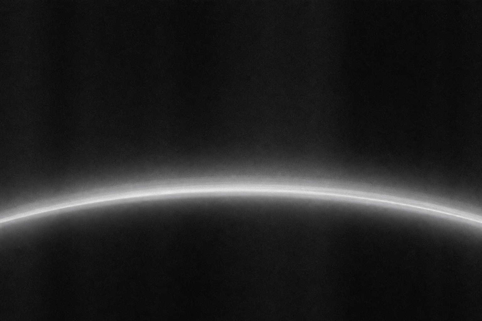 Long-exposure plate of a planetary limb showing stacked haze layers